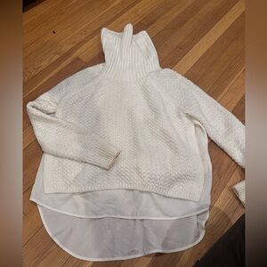 The limited cable knit white turtleneck